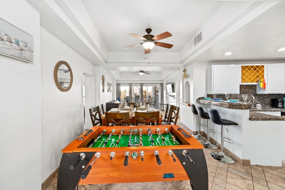 Dine, relax, or play – this inviting space includes seating for six and an in-unit foosball table.