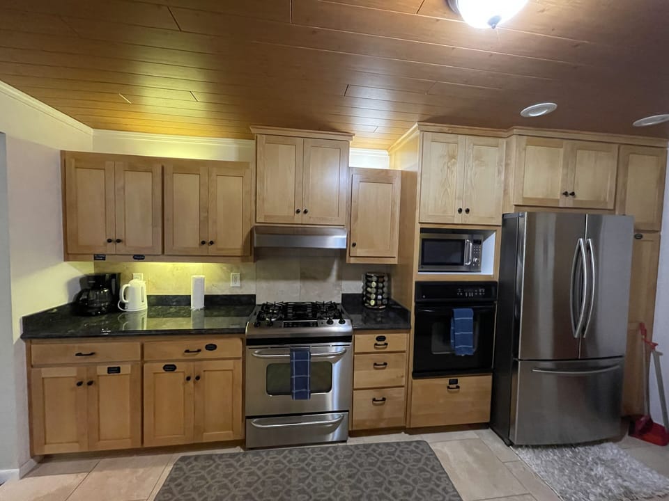 Coffee/ Tea Station, Kettle, Gas Range, Oven, Microwave, Refrigerator 