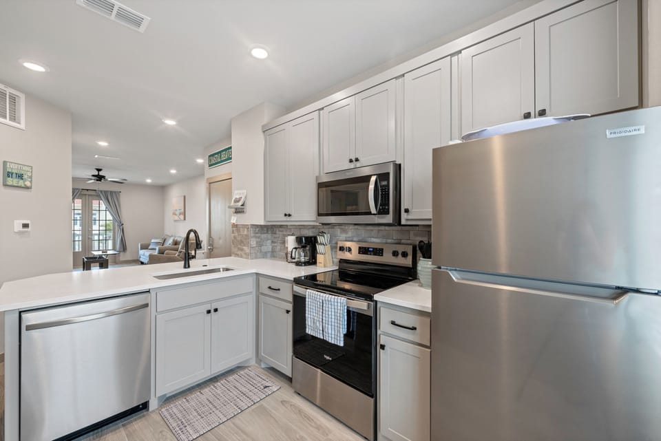 Your fully equipped kitchen awaits with stainless steel appliances, granite counters, and everything needed to create memorable meals during your stay.