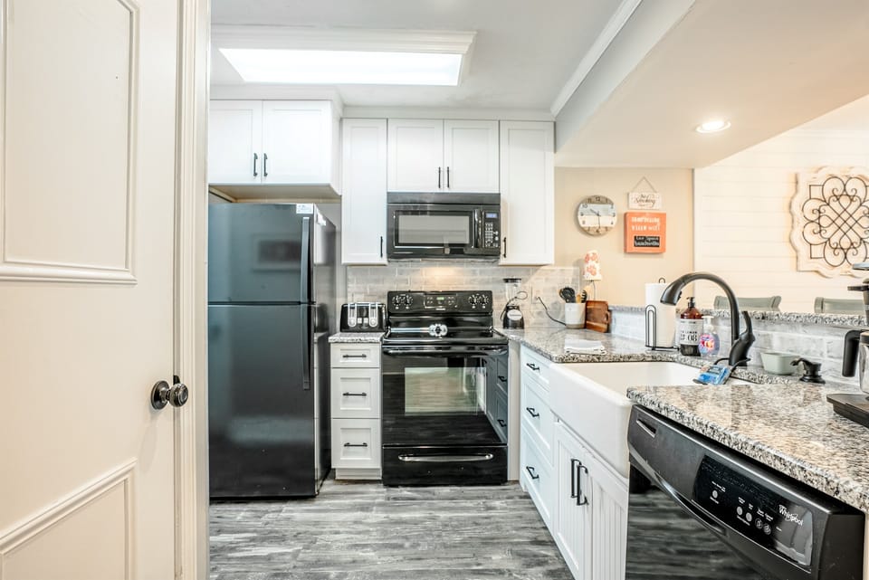 Updated kitchen with granite, all appliances and farmhouse sink
