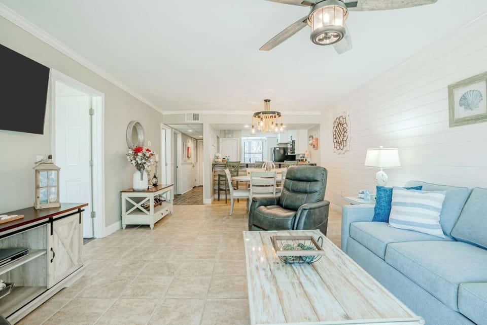 New sleeper sofa, two recliners, smart TV and ceiling fan in the living area
