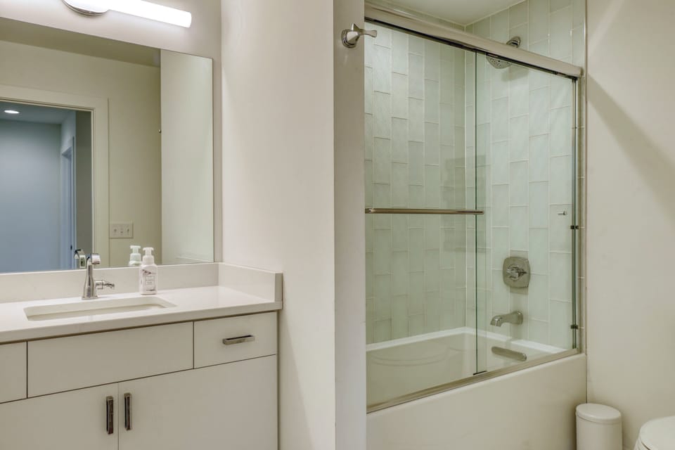 2nd full bath upper: one sink with quartz counter, shower over tub.