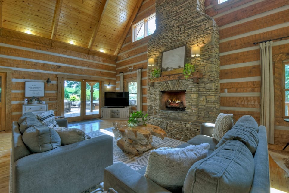 Sink into the sectional, and let the cathedral ceiling do what it's supposed to — make the whole place feel like it goes on forever."