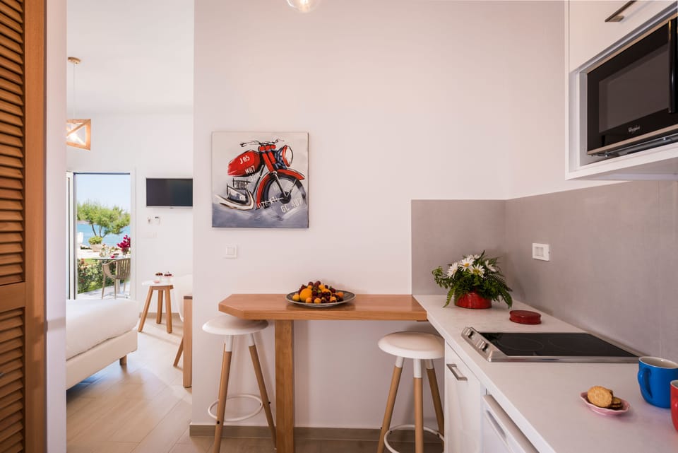 Superior Bungalow, Beachfront | Private kitchen | Fridge, stovetop, coffee/tea maker, electric kettle