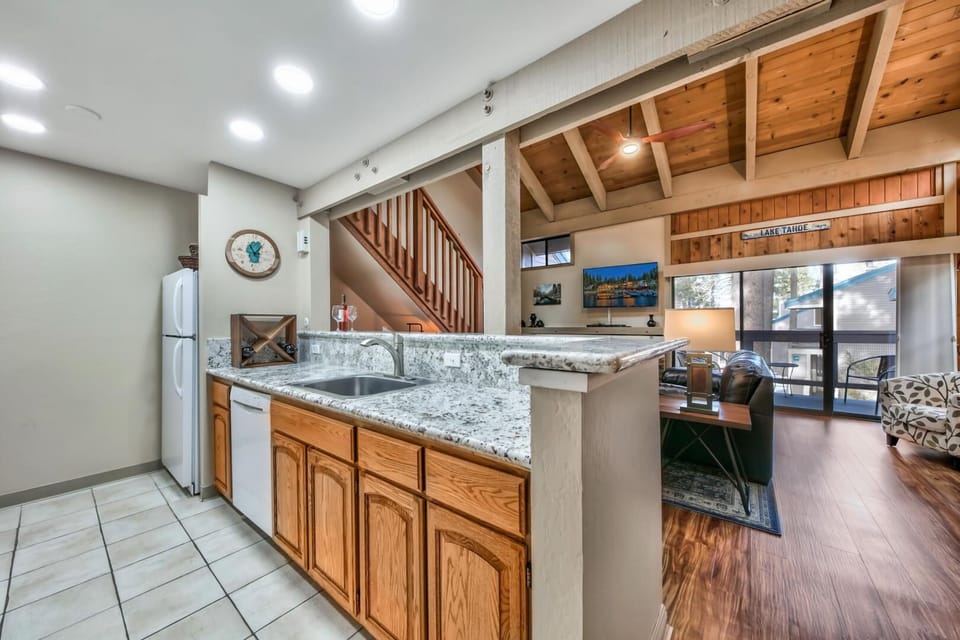 The kitchen is fully stocked with all of the cookware and cutlery you'll need. Note: the living room furniture has been updated since this photo was taken.