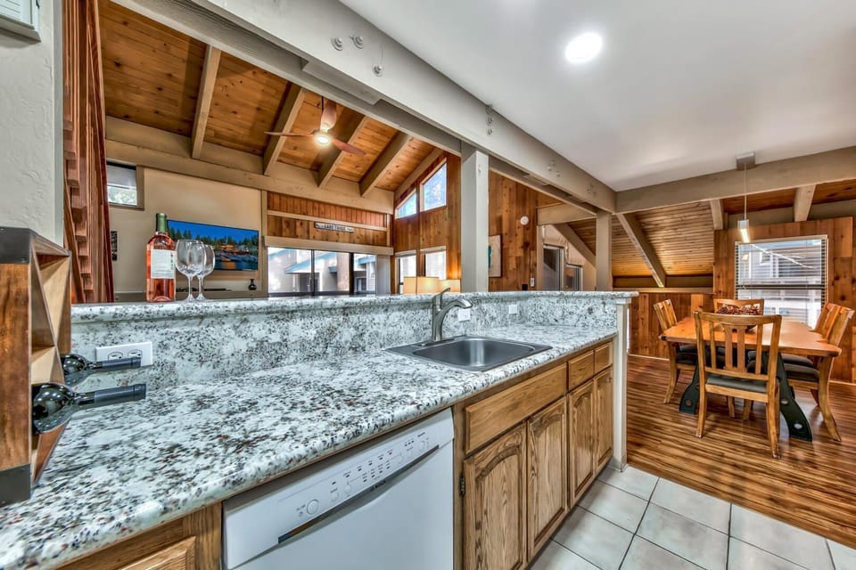 The open concept great room seamlessly connects the kitchen, dining area, and living room