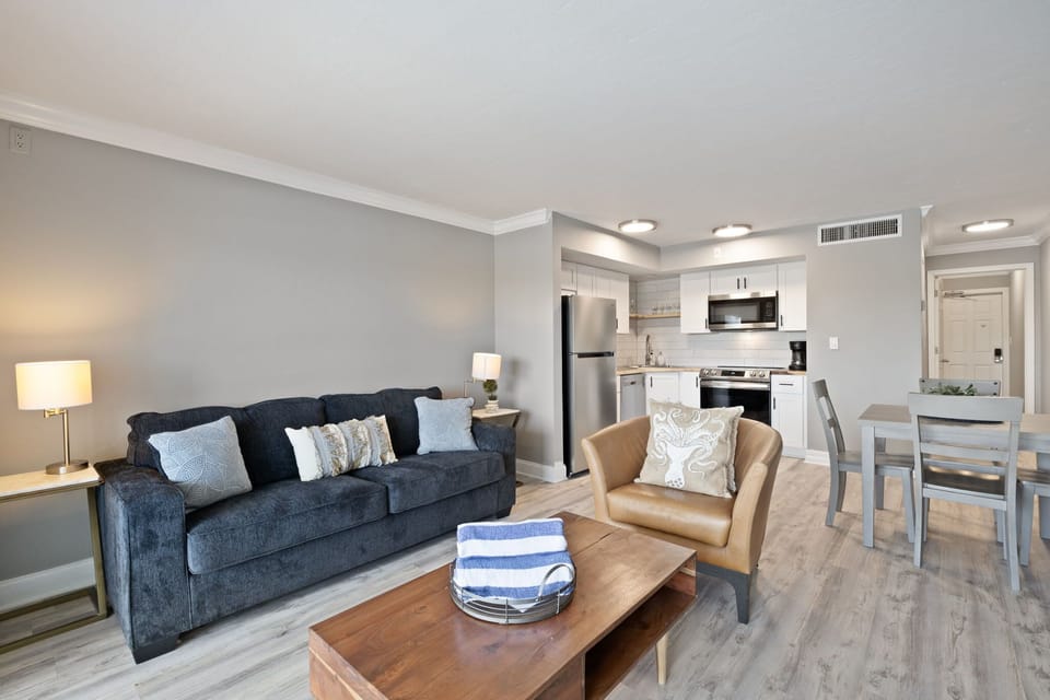 Expansive living room with full kitchen overlooking marina