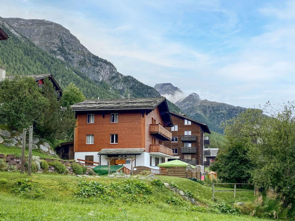 Sky, Cloud, Mountain, Plant, Property, Ecoregion, Building, Window, Natural Landscape, Highland