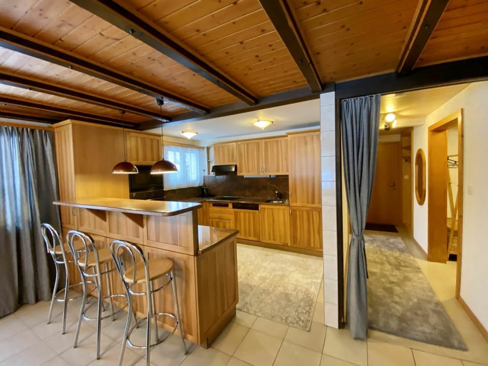 Furniture, Countertop, Wood, Cabinetry, Table, Building, Kitchen Appliance, Wood Stain, Kitchen, Chair