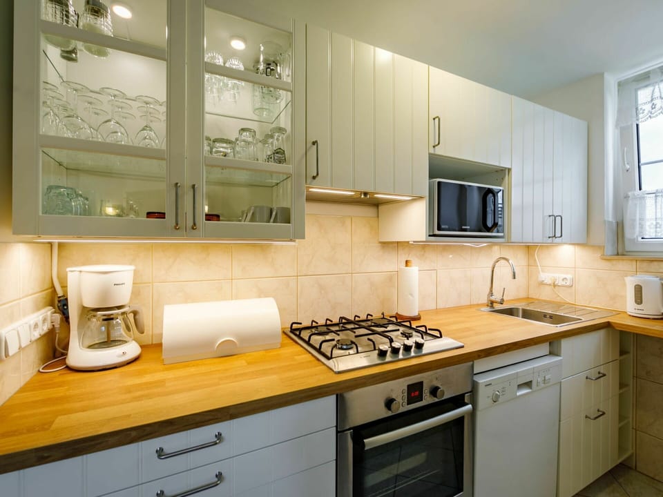 Cabinetry, Countertop, Property, Furniture, Kitchen Appliance, Kitchen Stove, Gas Stove, Kitchen, Drawer, Wood