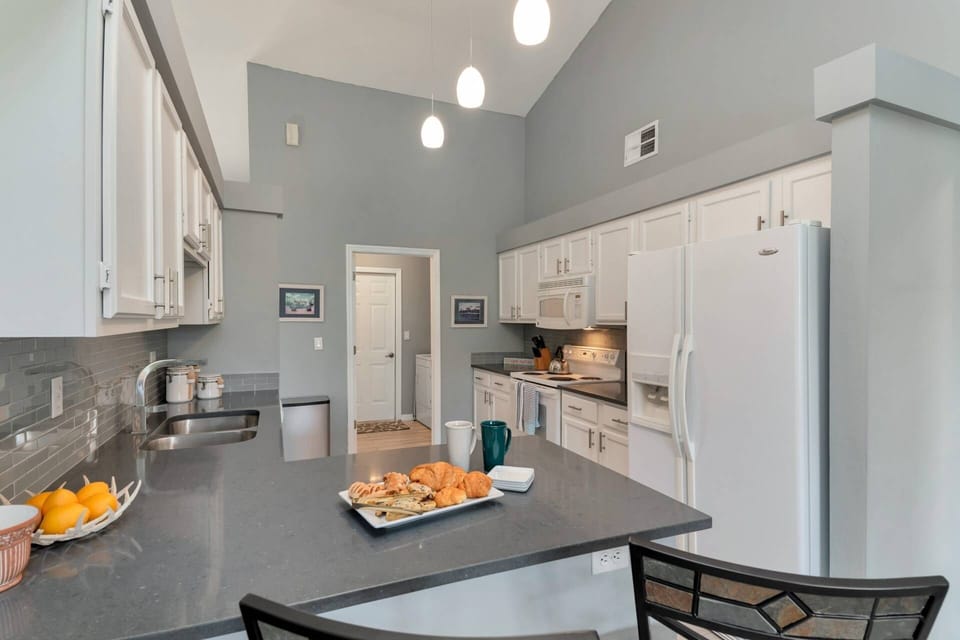 The kitchen features full-size appliances, ample storage and plenty of meal prep area.