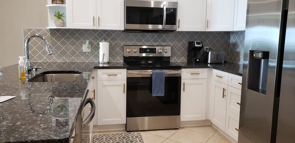 All new kitchen with new appliances, granite, cabinetry