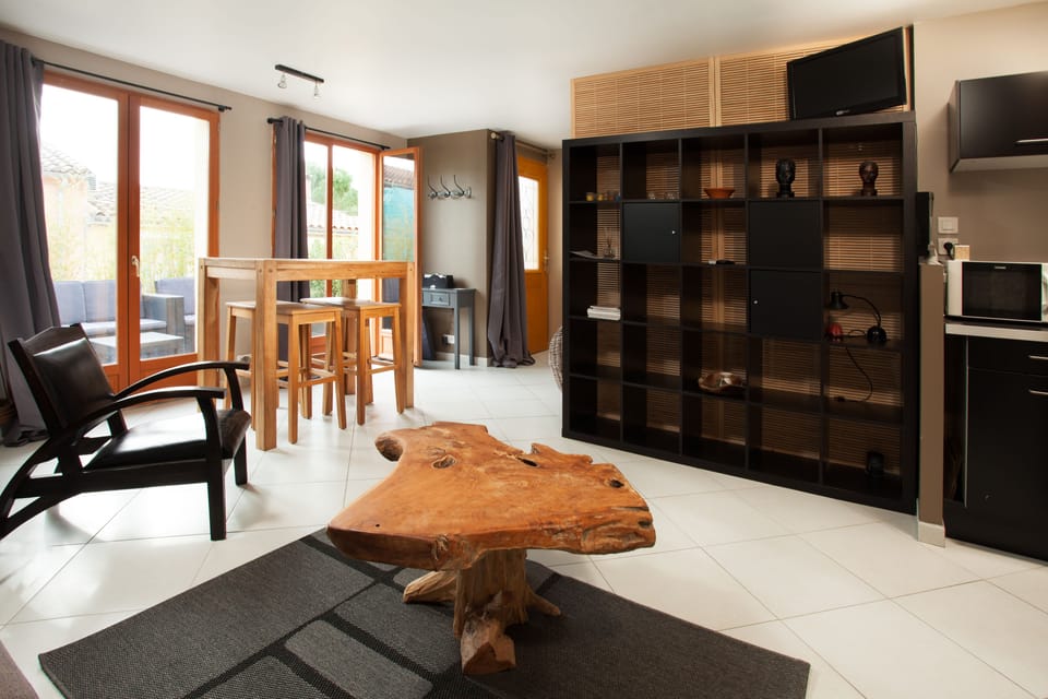 Superior Apartment, 1 Queen Bed | Living area | Flat-screen TV