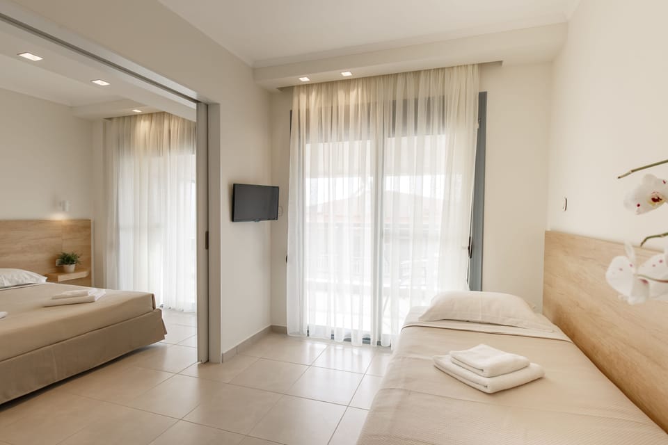 Suite, 2 Bedrooms, Partial Sea View | Minibar, in-room safe, desk, iron/ironing board