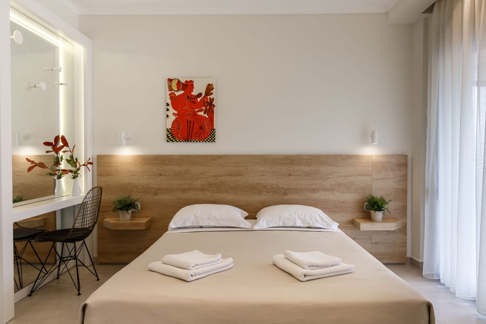 Suite, 2 Bedrooms, Partial Sea View | Minibar, in-room safe, desk, iron/ironing board