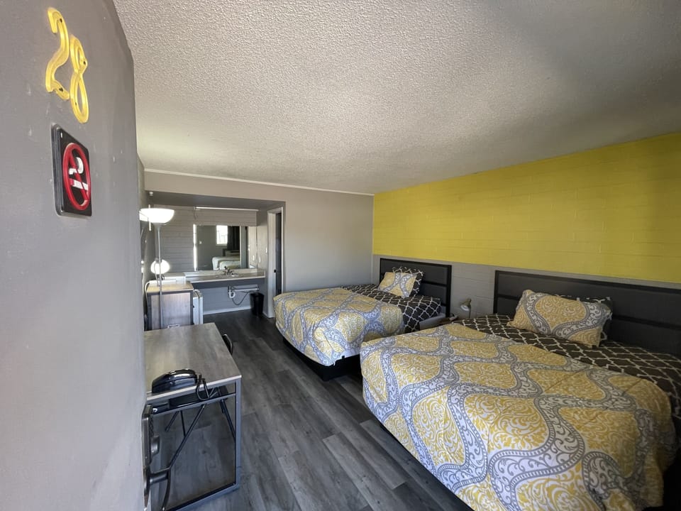 Deluxe Room, 2 Queen Beds, Non Smoking, Refrigerator & Microwave | Desk, blackout drapes, iron/ironing board (on request), WiFi (free)