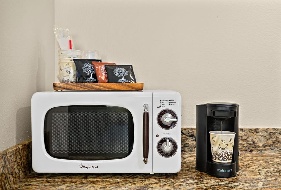 Fridge, microwave, coffee/tea maker, dining tables