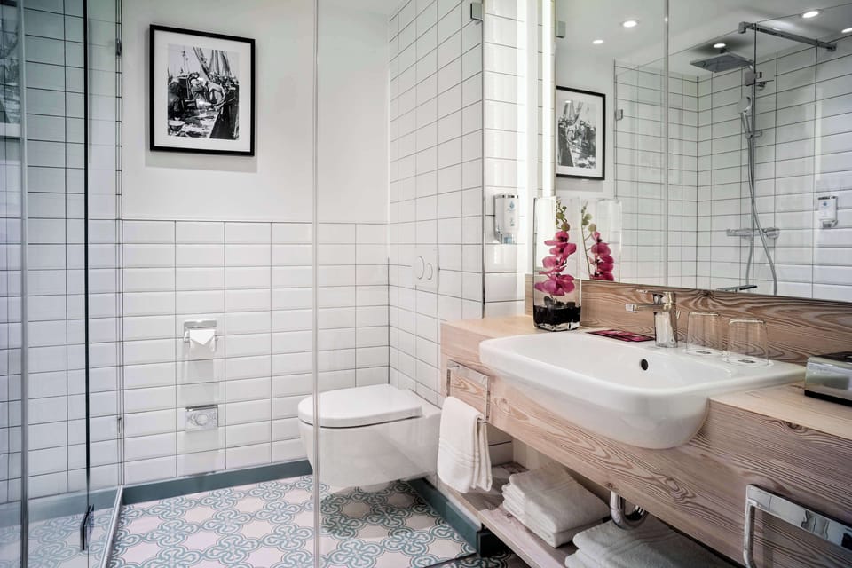 Shower, eco-friendly toiletries, hair dryer, bathrobes