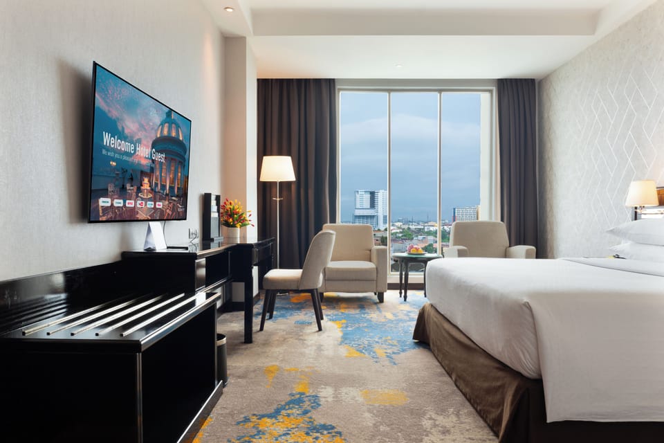 Large Room, 1 King Bed | Living area | 32-inch LED TV with cable channels, TV