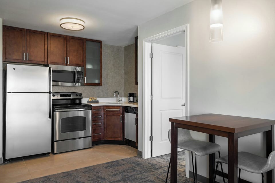 Suite, 1 Bedroom | Private kitchen | Fridge, microwave, stovetop, dishwasher