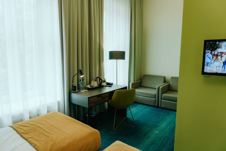 Premium bedding, desk, blackout drapes, soundproofing