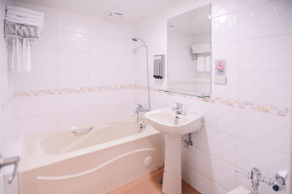 Standard Quadruple Room | Bathroom | Combined shower/tub, deep soaking tub, free toiletries, hair dryer
