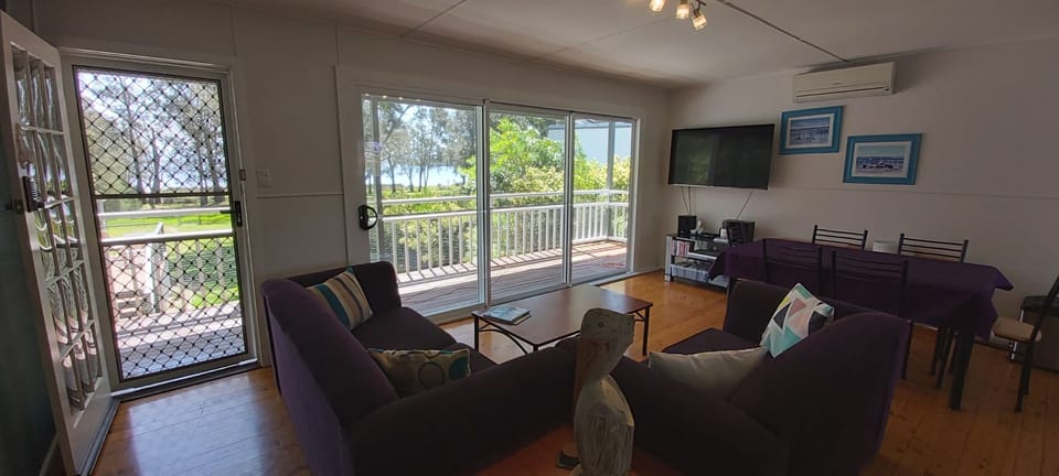 Deluxe House, 4 Bedrooms | Living area | 55-inch flat-screen TV with digital channels, Smart TV, Netflix