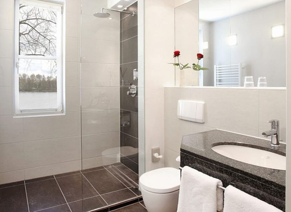 Shower, hair dryer, bathrobes, towels