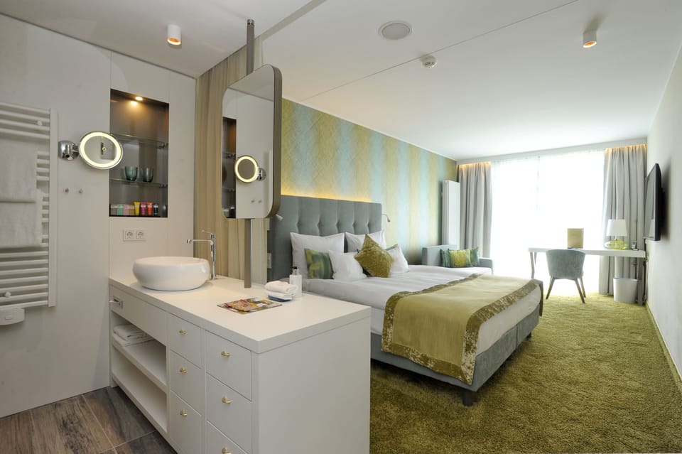 Hypo-allergenic bedding, free minibar, in-room safe, desk
