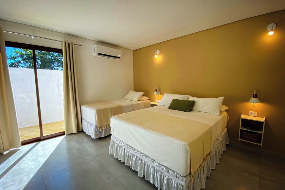Deluxe Quadruple Room (Bromélias) | Minibar, in-room safe, soundproofing, free WiFi
