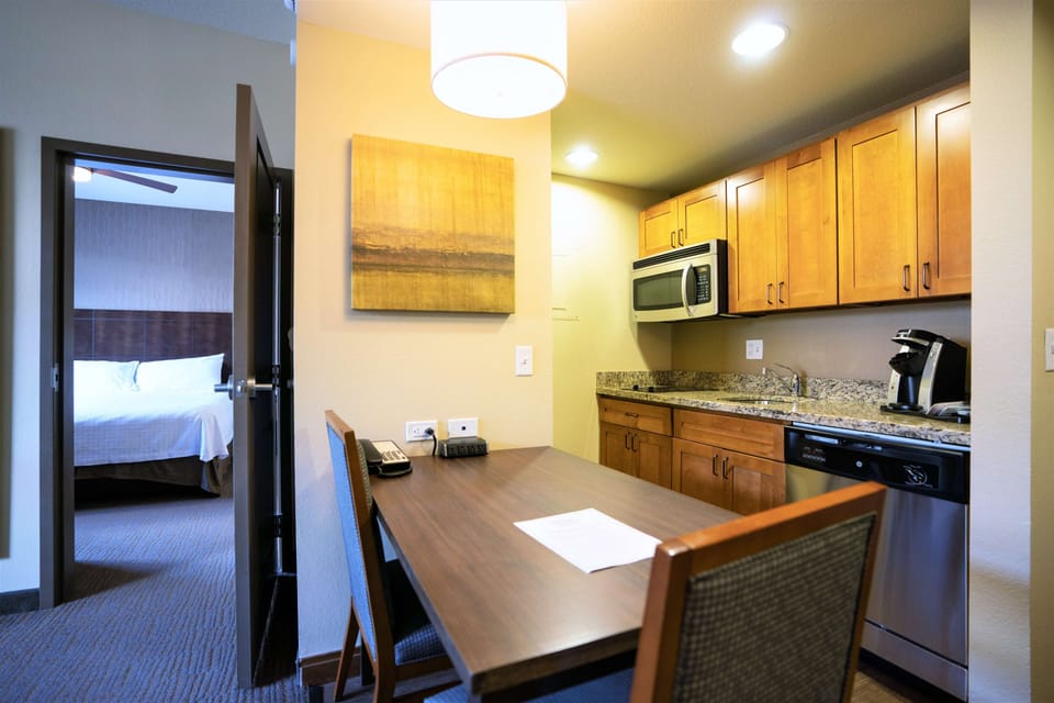 Suite, 1 King Bed | Private kitchen | Coffee/tea maker, full-size fridge, microwave, oven