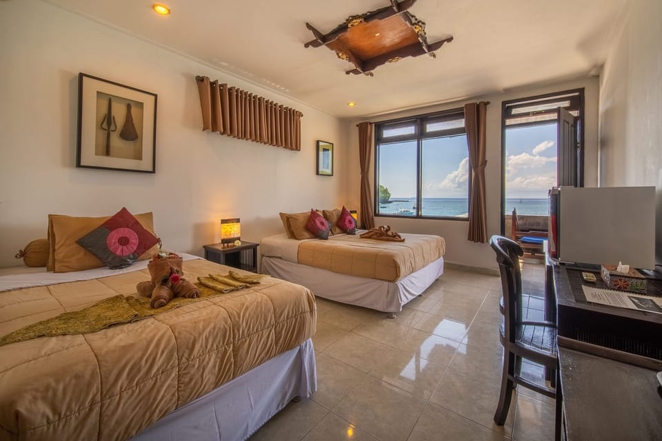 Triple Deluxe Room | Minibar, in-room safe, individually furnished, desk