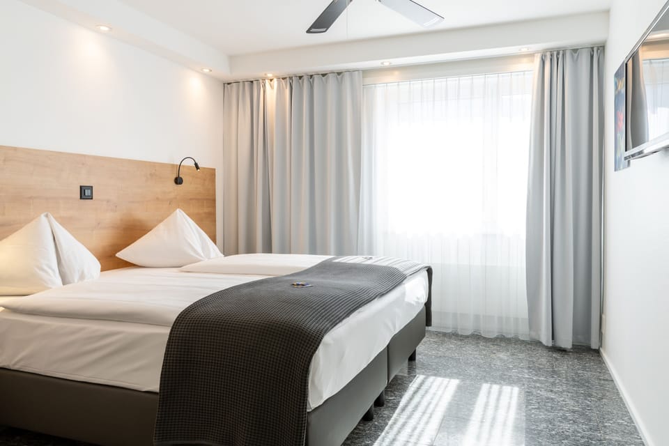 Double Room Single Use | Living area | Flat-screen TV