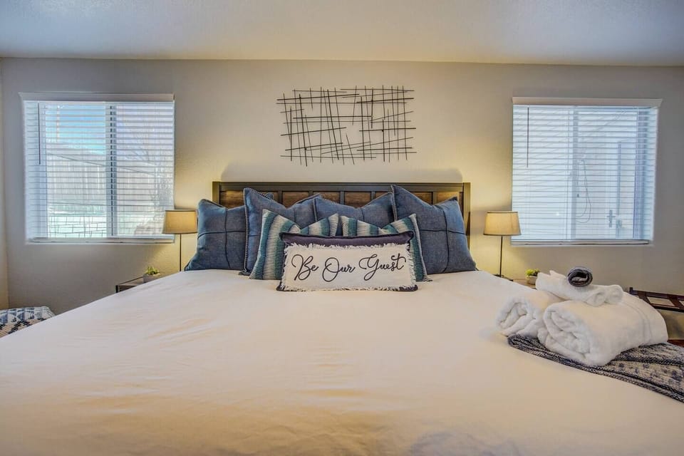 King Suite: Bright and airy retreat with plush pillows and inviting decor awaits your stay!