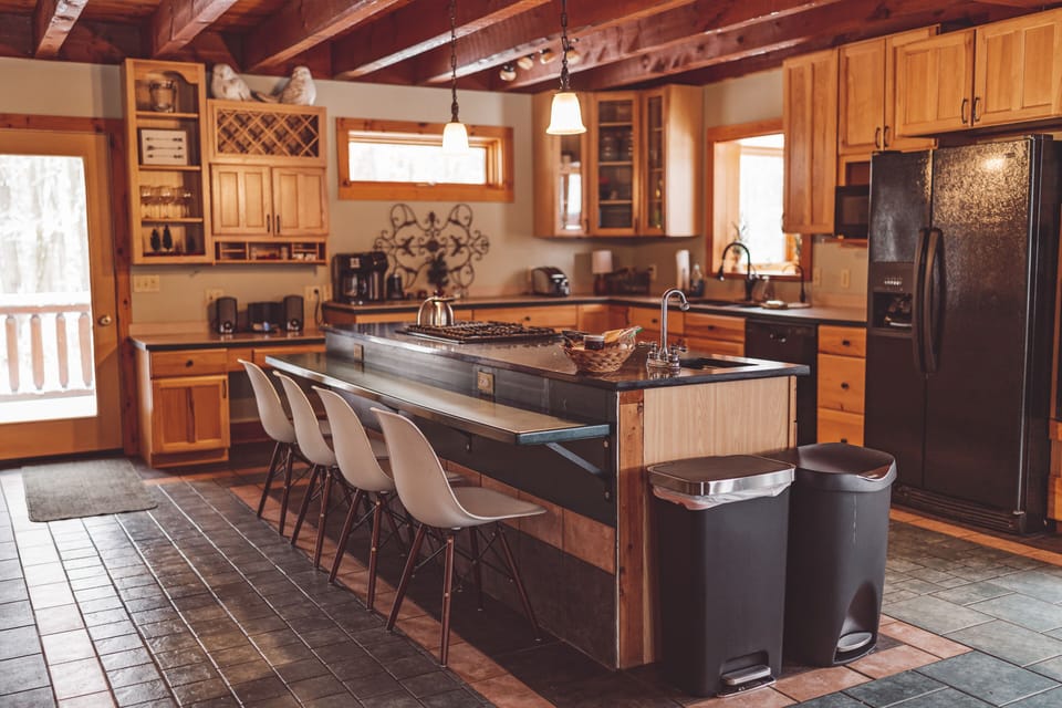 Spacious kitchen with ample island and dining table seating