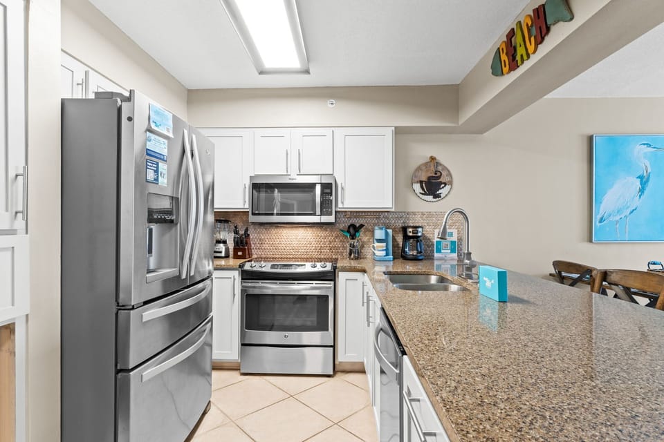 Kitchen - Granite counter tops and stainless steel appliances in this updated kitchen.