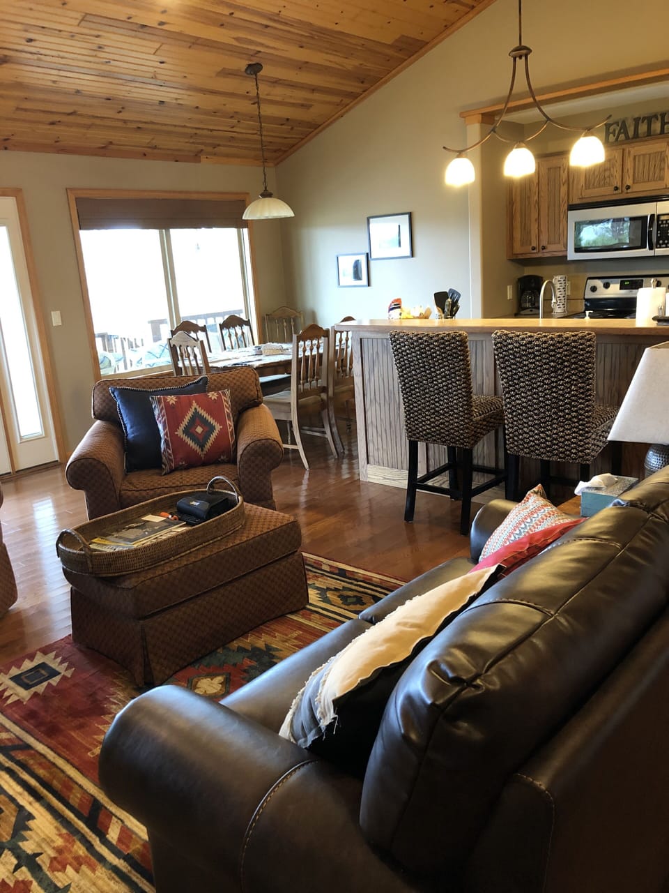Living room with gas fireplace and fully loaded kitchen