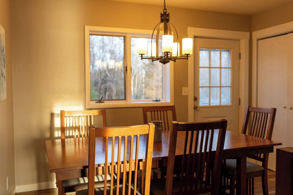 Main floor dining room perfect for family dinners and lakefront gatherings