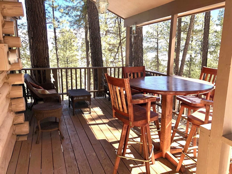 Dine Fresco-style under the covered deck, enjoy peek-a-boo views mountain/lake.