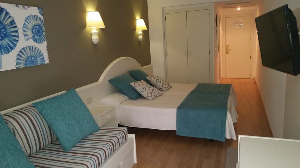Desk, blackout drapes, iron/ironing board, bed sheets