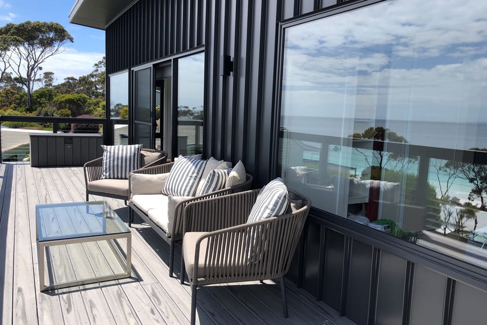 Deck has comfortable seating, and a WeberQ BBQ