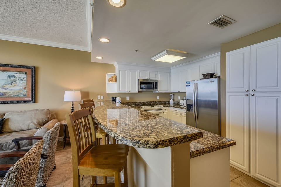 Fully Stocked Kitchen and Bar Areas