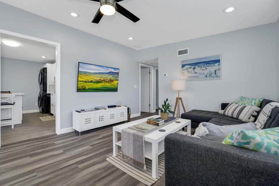 Living room with a smart TV that is enabled for streaming.