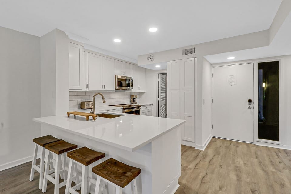 Kitchen/ - Who wouldn't want to sit at this bright and large counter and have breakfast or snack?!