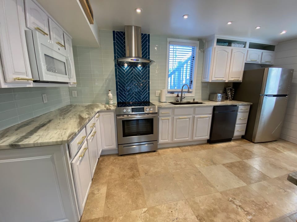 Full kitchen with stainless steel appliances