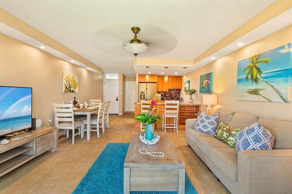 Tropical charm meets comfort in this breezy living space.