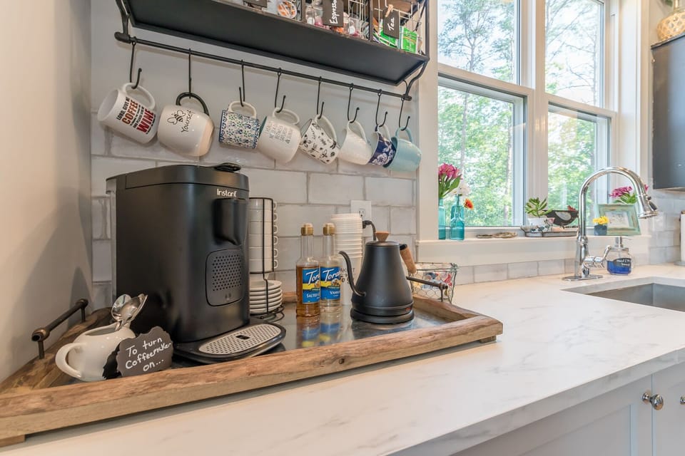 Coffee bar with k-cup/espresso coffee maker and electric tea kettle. 