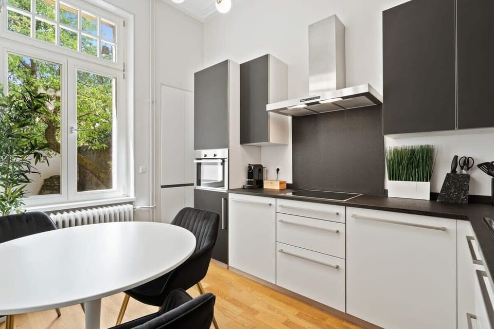 Enjoy intimate meals in a sunlit space with garden views, perfect for morning coffee or dinner for two. Direct bookings: www.arcaproperties.lu