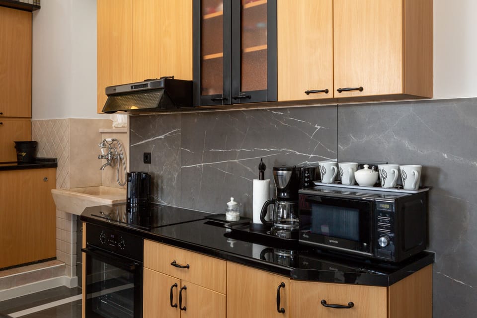 Panoramic Apartment | Private kitchen | Oven, stovetop, electric kettle, highchair