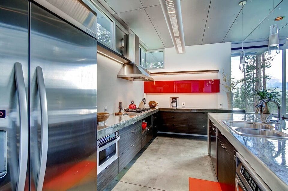 The open kitchen and ample countertops make meal prep easy for multiple cooks.